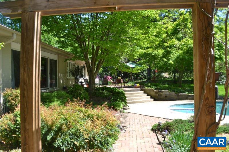 1503 Rugby Road Charlottesville, VA 22903 - Photo 30 of 40 a view of a yard with plants and large trees