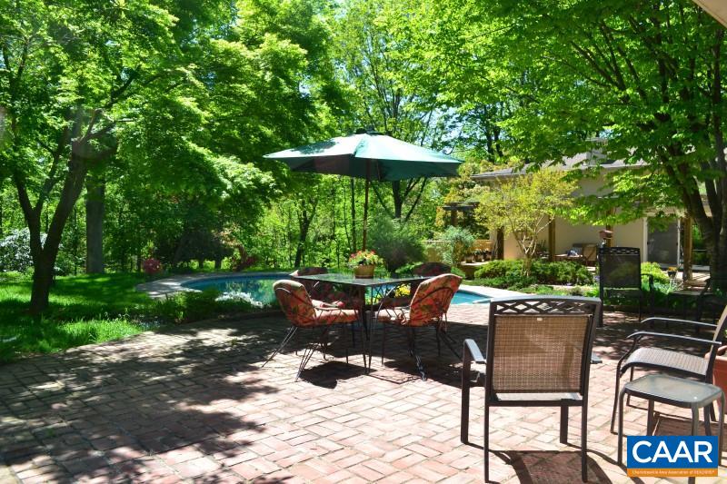 1503 Rugby Road Charlottesville, VA 22903 - Photo 3 of 40 a view of a patio with a table chairs and a fire pit