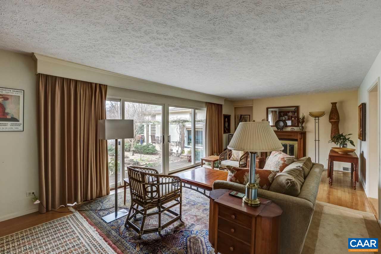 1503 Rugby Road Charlottesville, VA 22903 - Photo 5 of 40 a living room with furniture and large windows