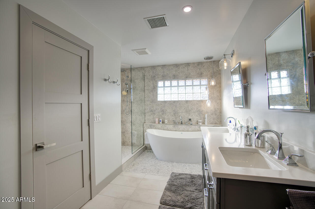 3337 East Las Rocas Drive Phoenix, AZ 85028 - Photo 15 of 22 a bathroom with a sink toilet tub and shower