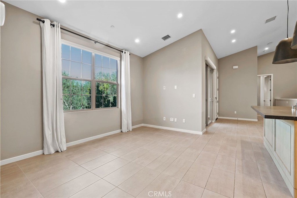 110 Coastal Garden Irvine, CA 92618 - Photo 12 of 33 a view of empty room with wooden floor and fan