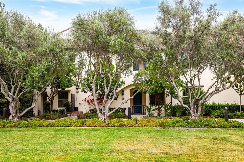 110 Coastal Garden Irvine, CA 92618 - Photo 2 of 33 a front view of a house with a yard and large trees