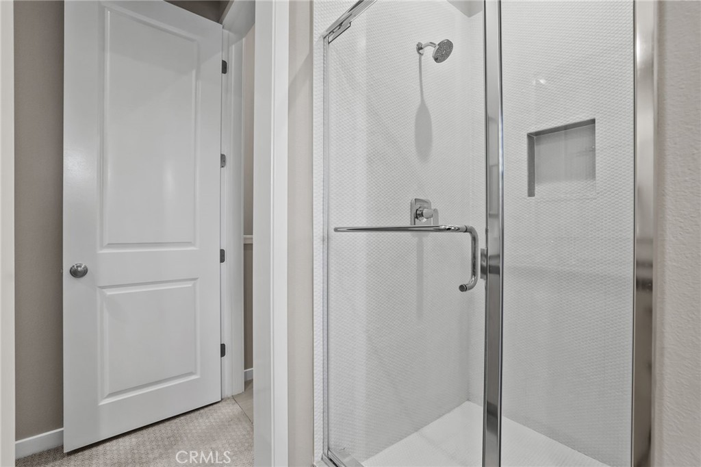 110 Coastal Garden Irvine, CA 92618 - Photo 22 of 33 a bathroom with a shower