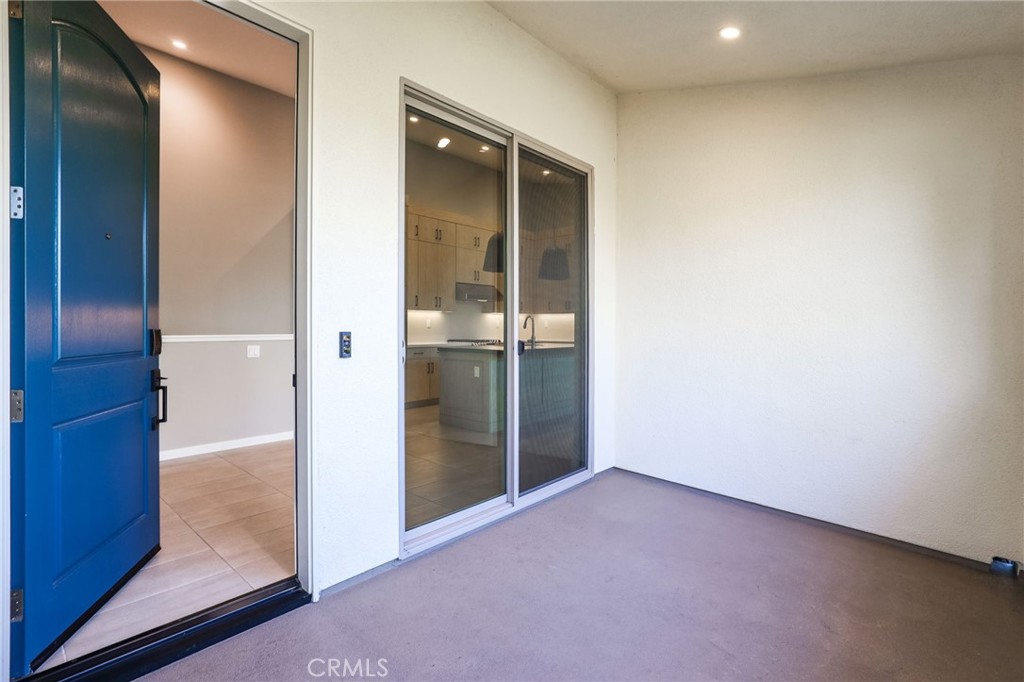 110 Coastal Garden Irvine, CA 92618 - Photo 5 of 33 an empty room with sliding glass door