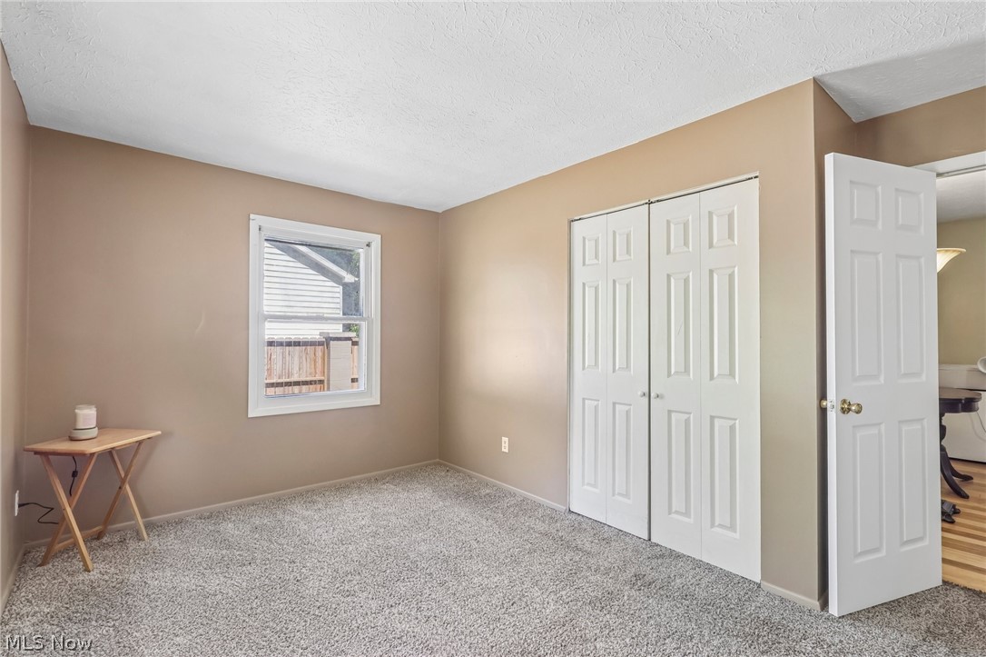 2960 Rome Rock Creek Road Rock Creek, OH 44084 - Photo 31 of 49 Neutral tone walls with gray carpet flooring