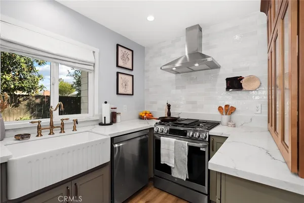 a kitchen with a stove and a sink