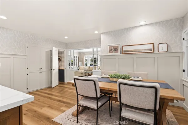 a kitchen with a table and chairs in it
