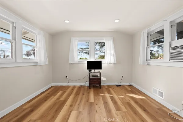 a room with a bed and window