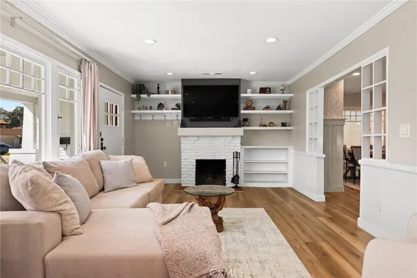 a living room with furniture fireplace and flat screen tv