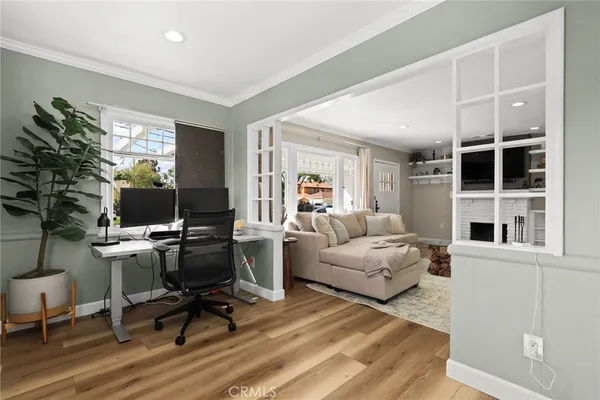 a living room with furniture rug and window