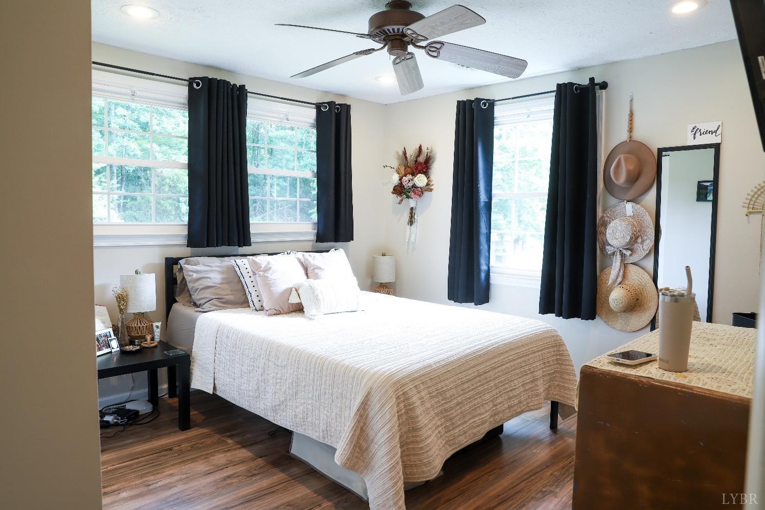 483 Pauls Road Rustburg, VA 24588 - Photo 13 of 21 a bedroom with a bed and a chandelier