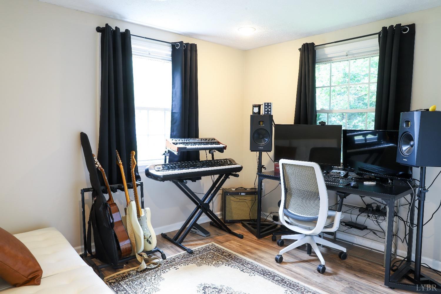 483 Pauls Road Rustburg, VA 24588 - Photo 14 of 21 a view of a workspace with furniture and a window