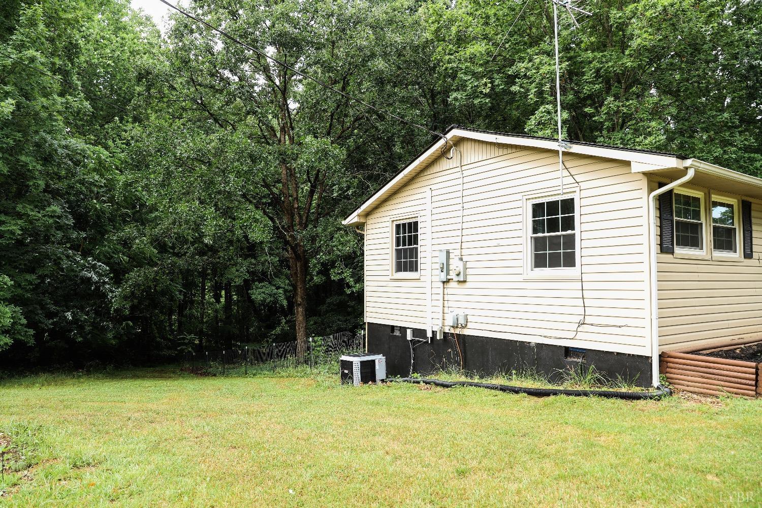 483 Pauls Road Rustburg, VA 24588 - Photo 5 of 21 a view of a house with a yard