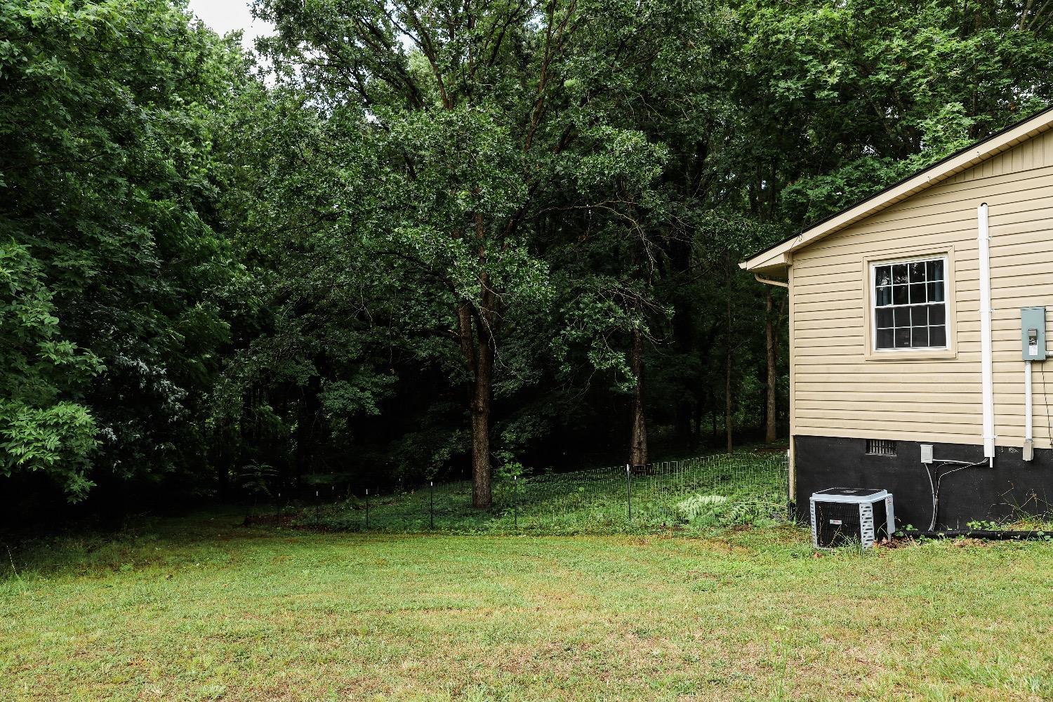 483 Pauls Road Rustburg, VA 24588 - Photo 6 of 21 a backyard of a house with table and chairs