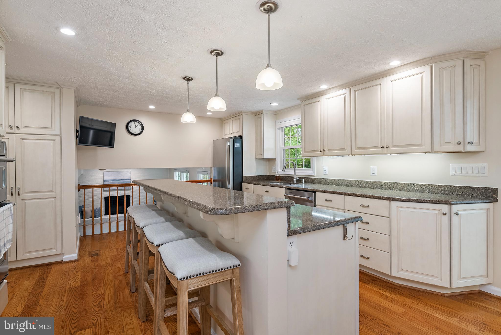 333 Brunswick Place Riva, MD 21140 - Photo 10 of 60 a large kitchen with granite countertop a sink a counter space appliances and cabinets