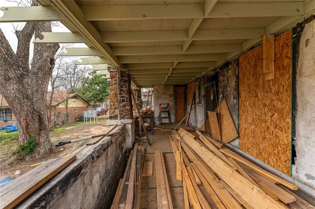 a view of a balcony with chairs