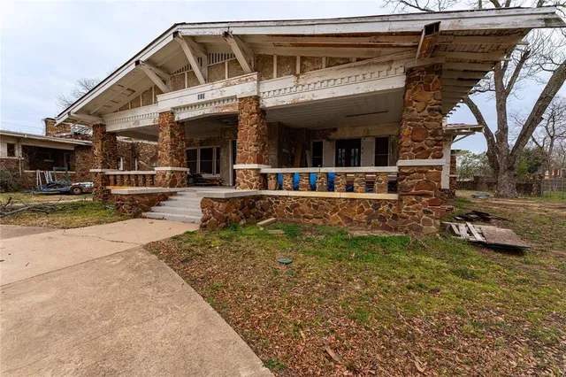 a view of a house with a large window and a view of the house