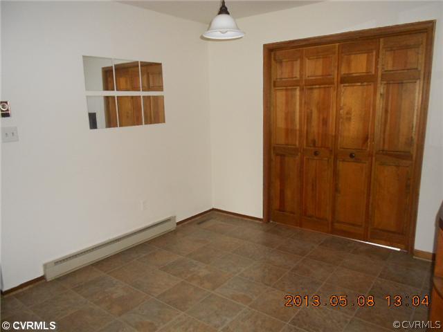 144 Mahan Road Farmville, VA 23901 - Photo 8 of 13 an empty room with wooden floor and windows