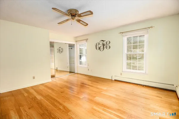 a view of an empty room with a window