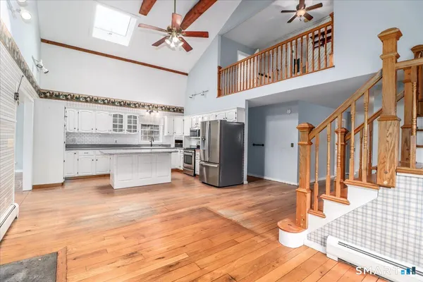 a view of an entryway with wooden floor