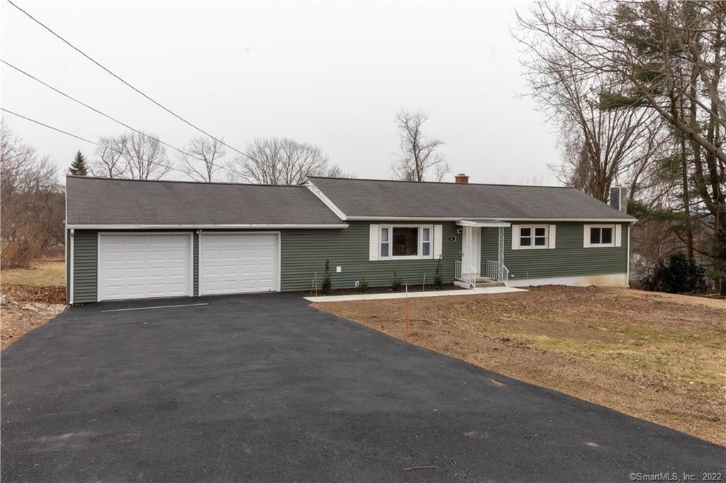 61 Greystone Road Waterbury, CT 06704 - Photo 1 of 1 a front view of house with yard and trees