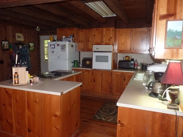 340 Holloman Road Gray, GA 31032 - Photo 19 of 22 a kitchen with a sink a stove and chairs
