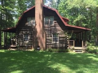 340 Holloman Road Gray, GA 31032 - Photo 5 of 22 a view of a house with a yard