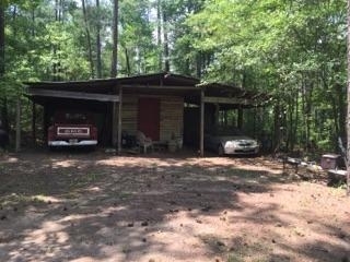 340 Holloman Road Gray, GA 31032 - Photo 7 of 22 a view of a car parked in front of house