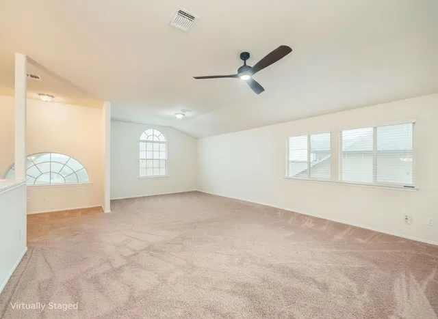 a view of an empty room with a window
