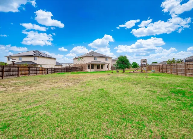 a view of a house with a big yard