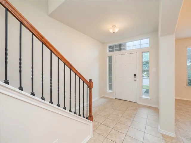 a view of a hallway with staircase