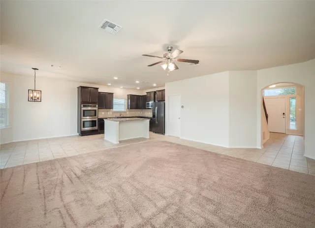 a view of a kitchen with a sink and a kitchen counter top space