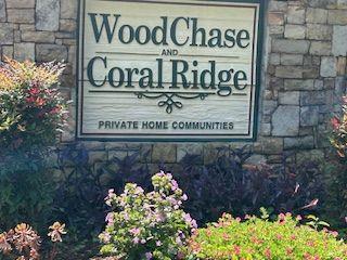 a sign broad in front of flowers