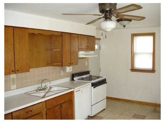 414 Fitch Road Rockford, IL 61109 - Photo 5 of 10 a kitchen with a sink cabinets and window