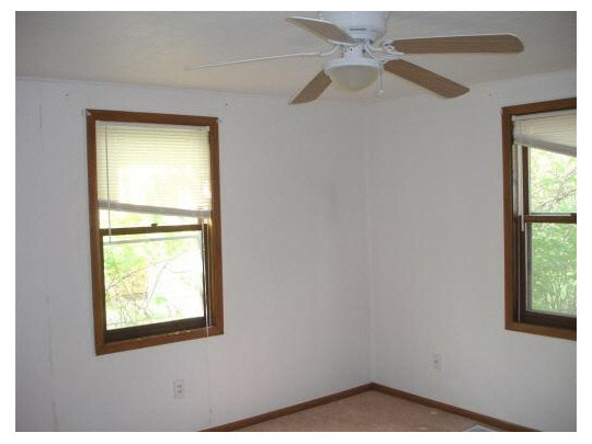 414 Fitch Road Rockford, IL 61109 - Photo 6 of 10 a view of an empty room with a window
