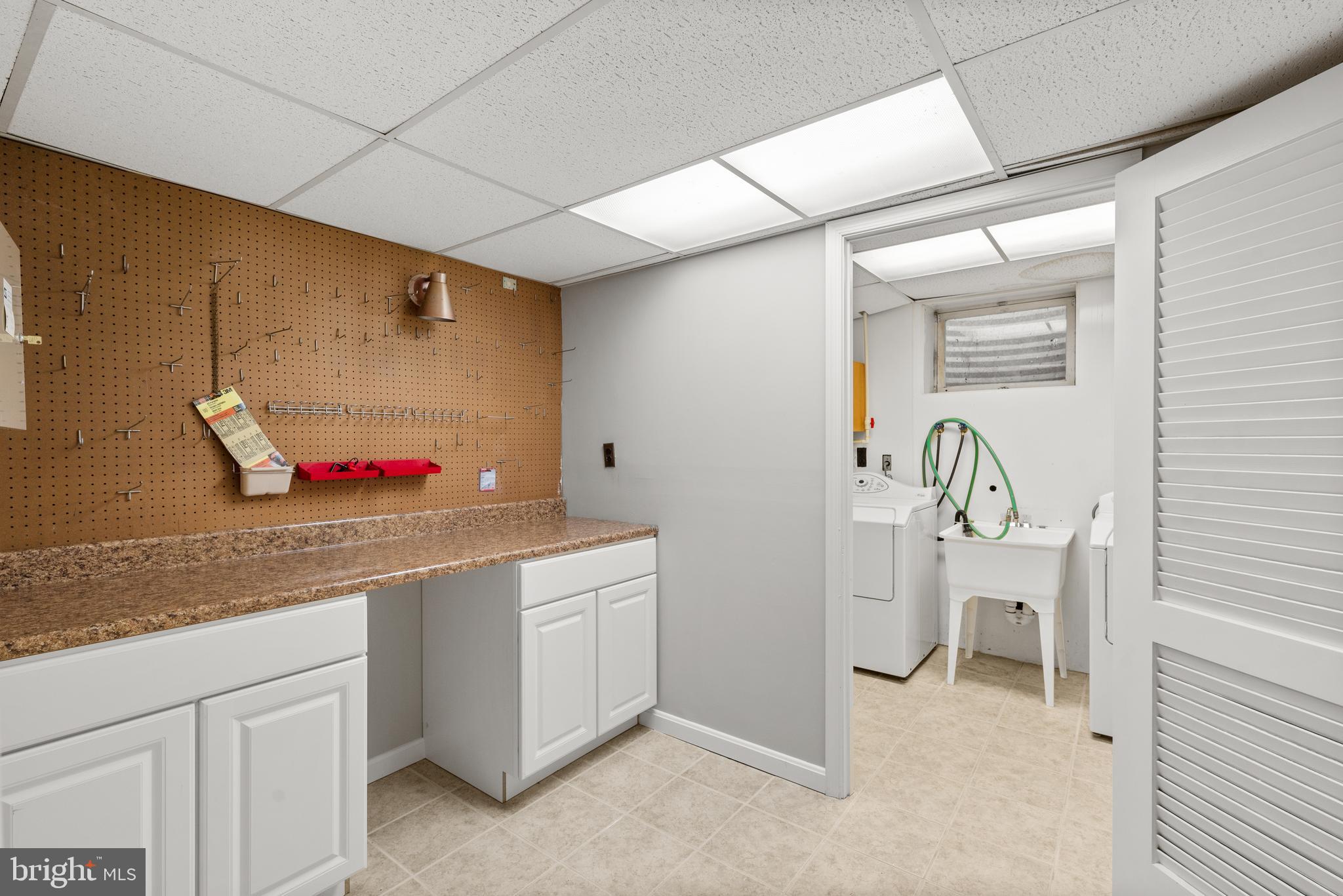 10711 Sandy Landing Road Potomac, MD 20854 - Photo 27 of 36 Lower level work room & laundry area