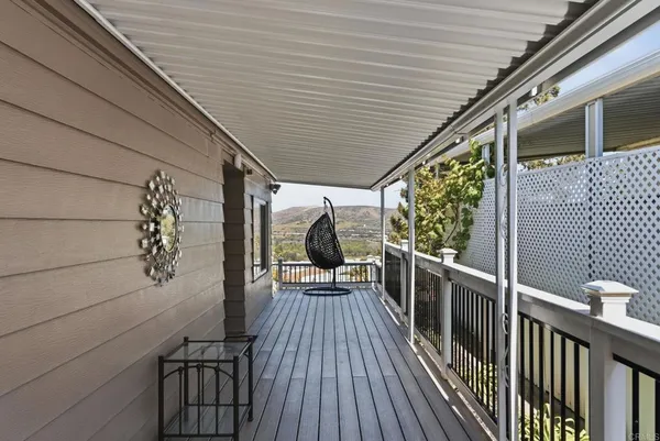 a view of a balcony with chairs