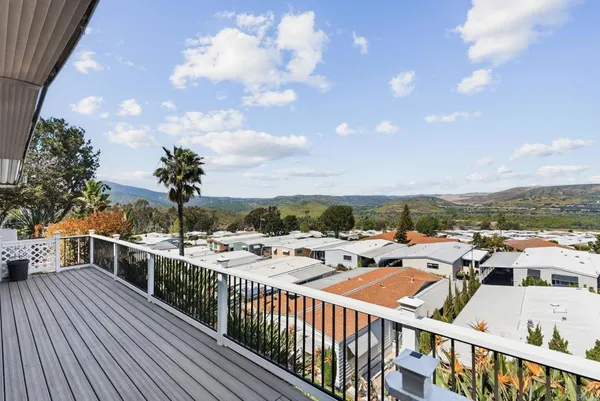 a view of a balcony with city view