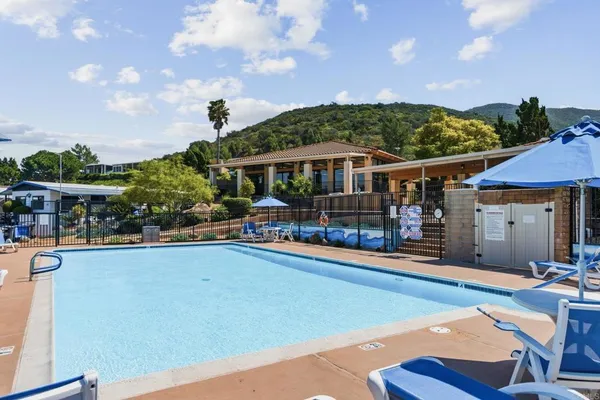 a view of a patio with swimming pool table and chairs