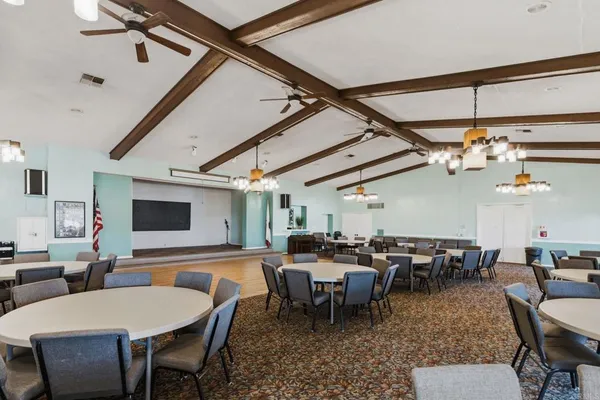 a kitchen with a large window and cabinets
