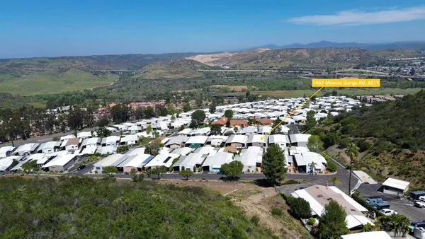 a view of a city with mountains in the background