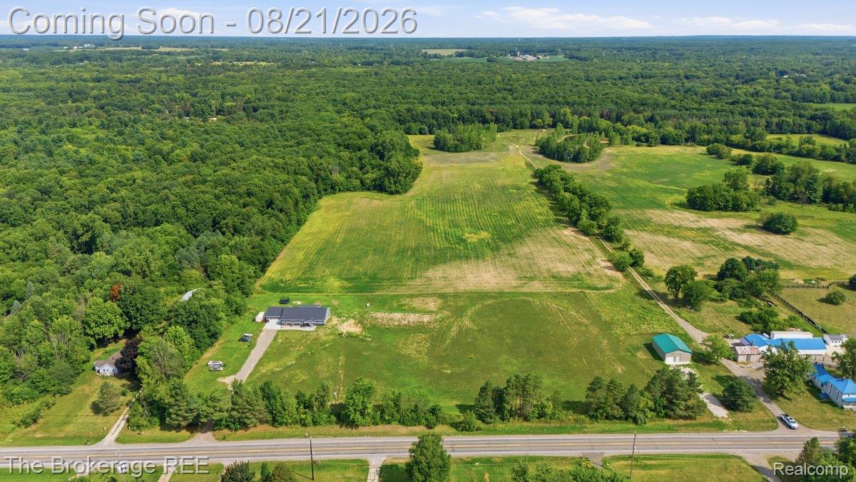 9161 East Coldwater Road Davison, MI 48423 - Photo 49 of 52 Expansive acreage featuring a substantial cultivated field, mature woodland, and road frontage