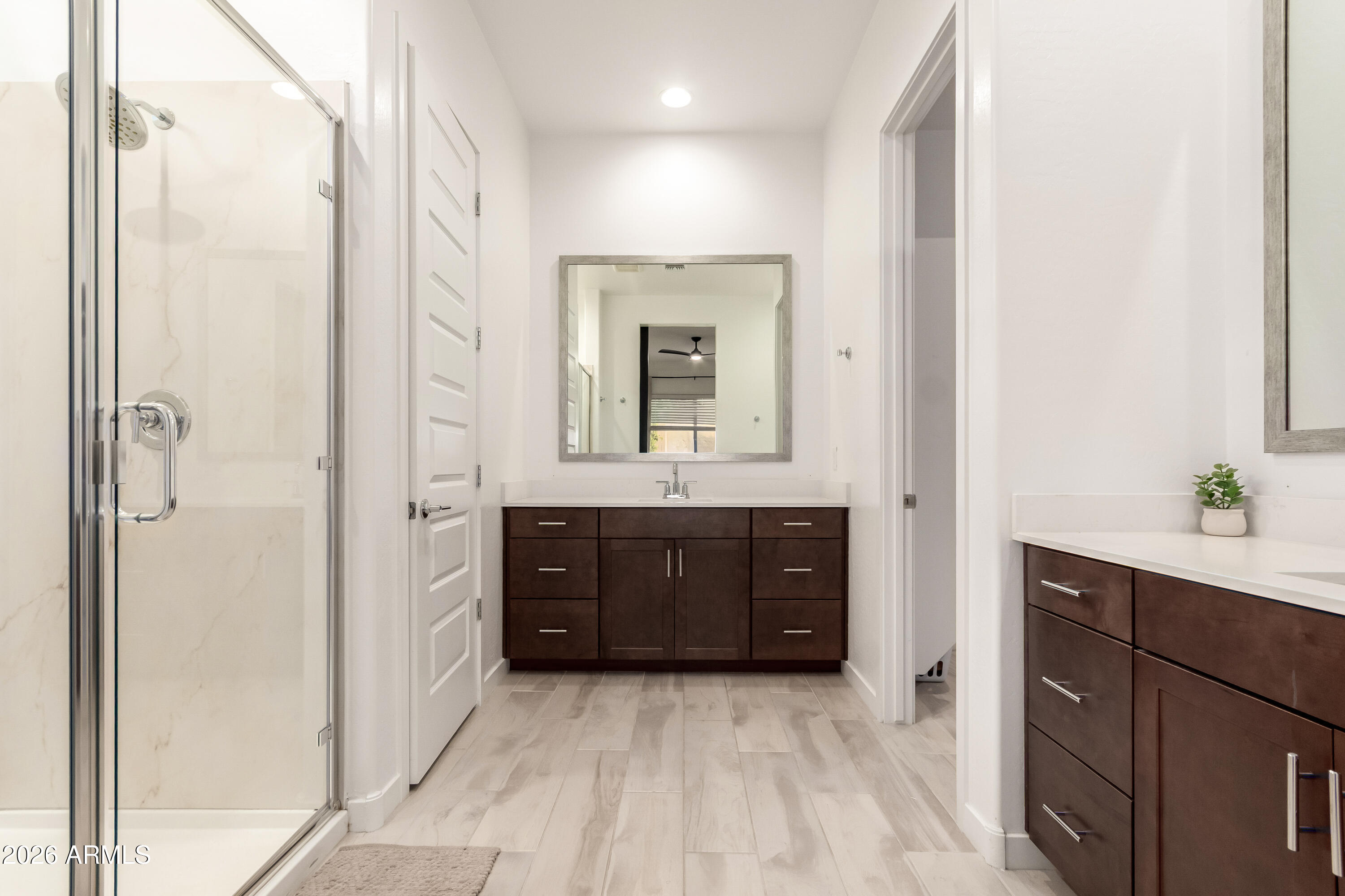 2034 West Sleepy Ranch Road Phoenix, AZ 85085 - Photo 12 of 35 a bathroom with a granite countertop sink mirror and a shower