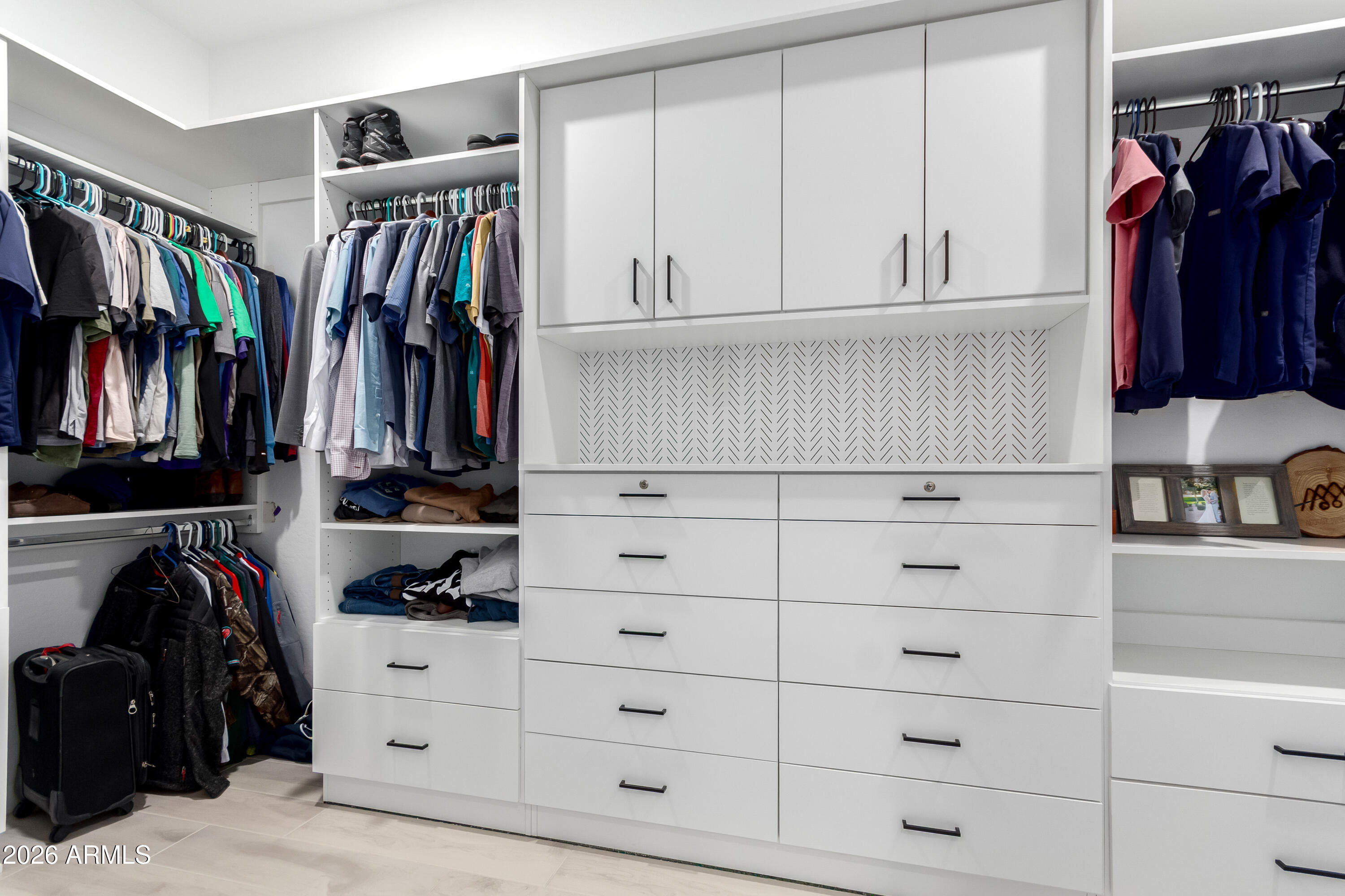 2034 West Sleepy Ranch Road Phoenix, AZ 85085 - Photo 13 of 35 a view of walk in closet with clothes and shoes
