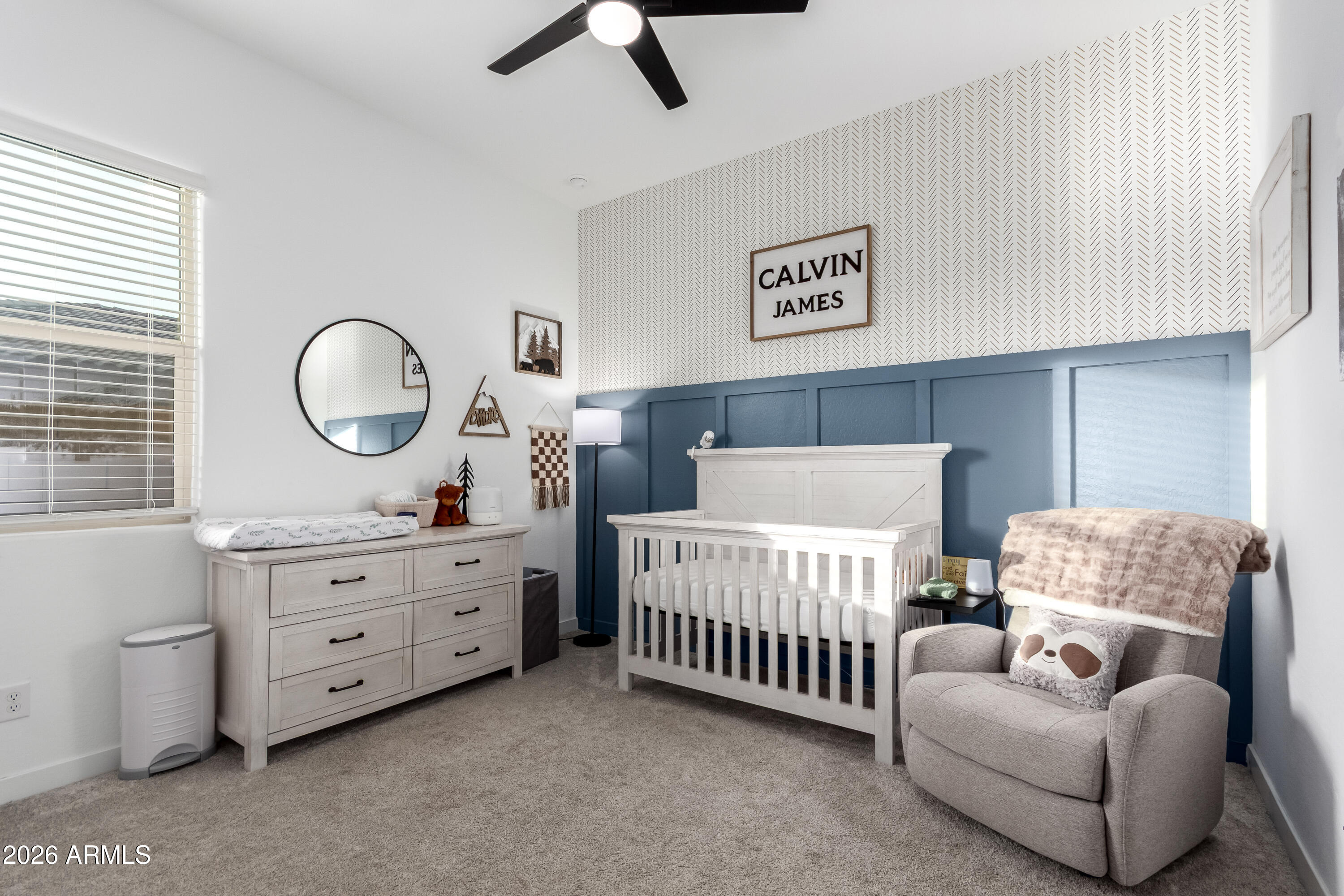 2034 West Sleepy Ranch Road Phoenix, AZ 85085 - Photo 14 of 35 a bedroom with bed and a chandelier