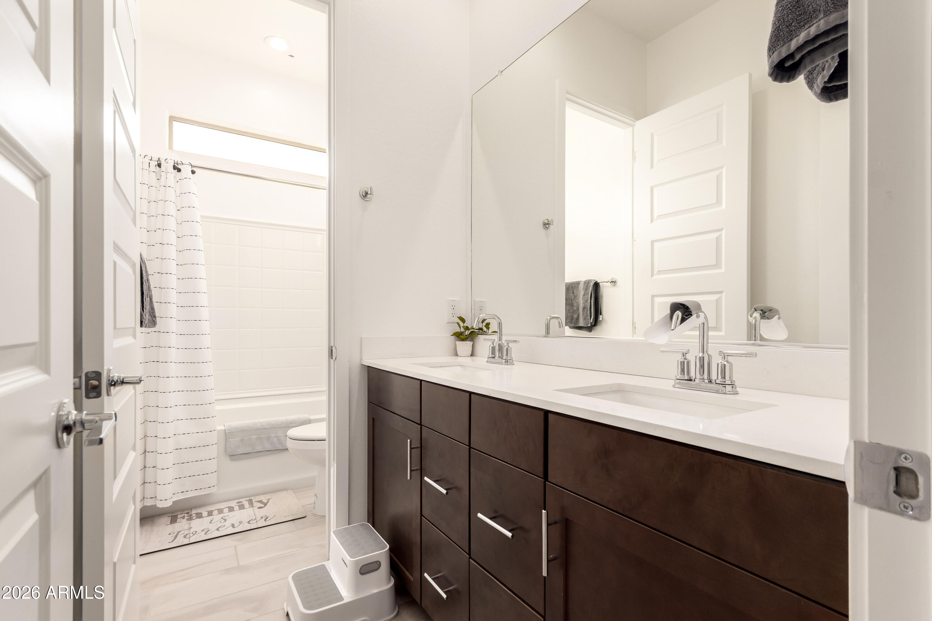 2034 West Sleepy Ranch Road Phoenix, AZ 85085 - Photo 16 of 35 a bathroom with a sink and a mirror