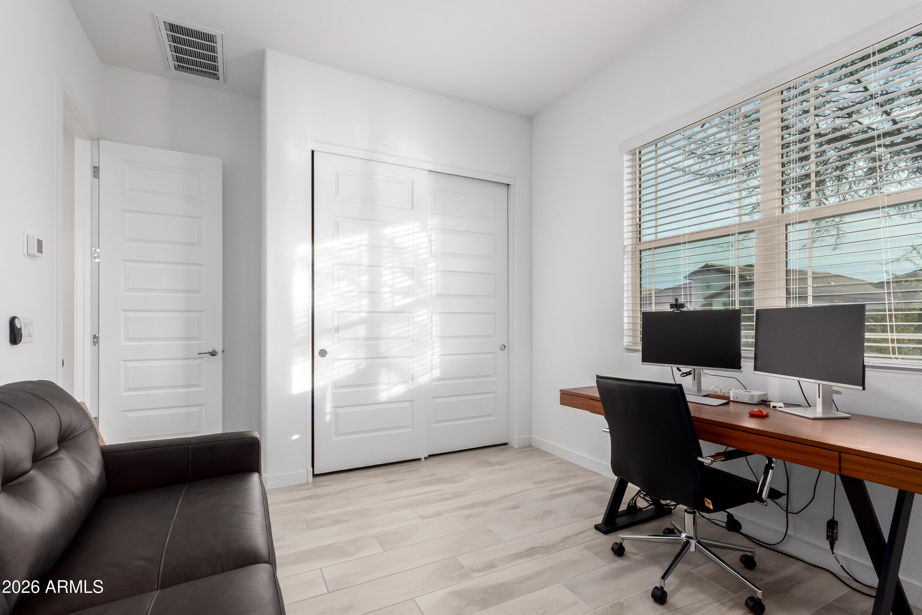 2034 West Sleepy Ranch Road Phoenix, AZ 85085 - Photo 18 of 35 a view of a workspace with furniture and a window