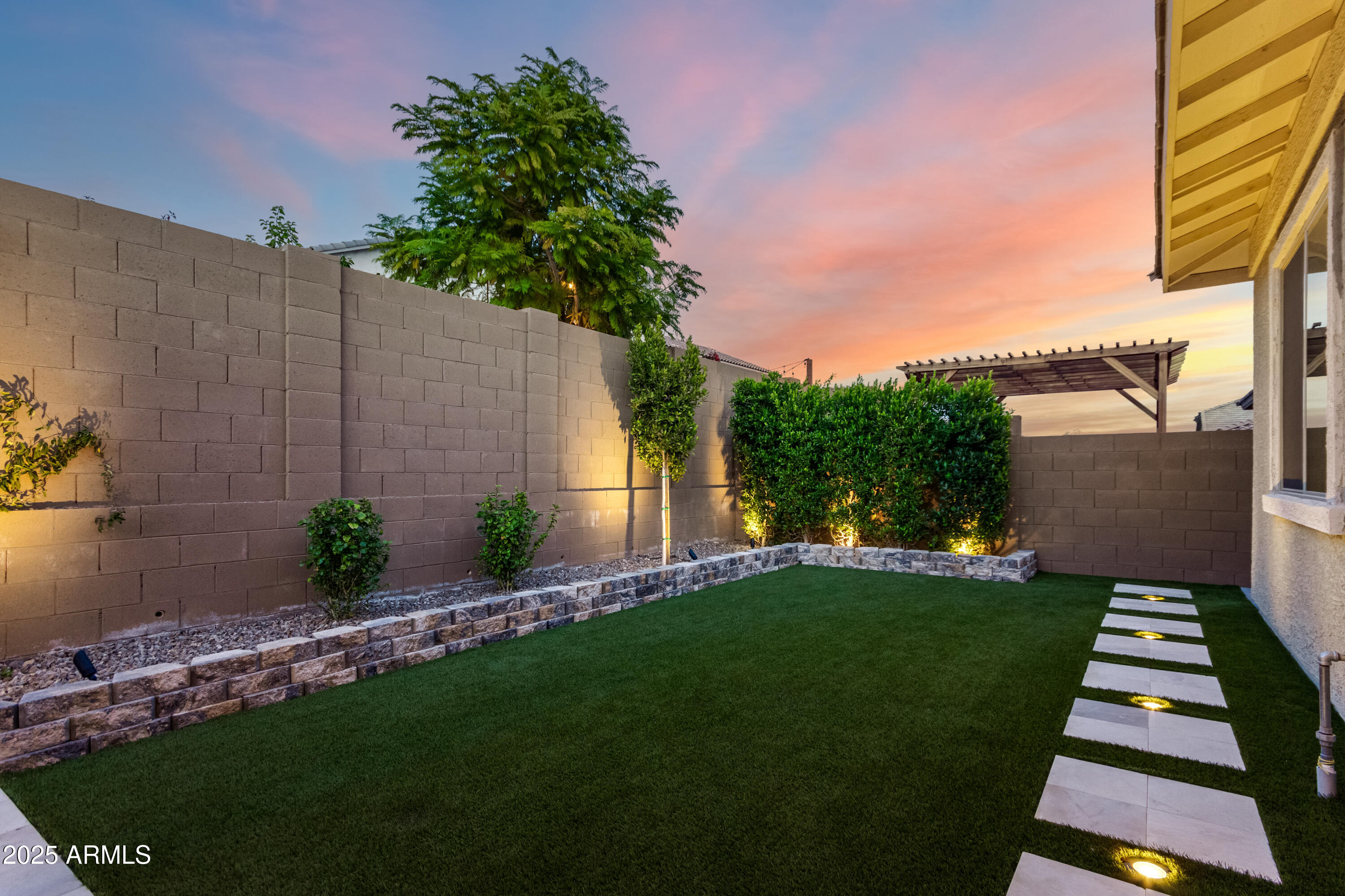 2034 West Sleepy Ranch Road Phoenix, AZ 85085 - Photo 25 of 35 a view of a backyard with potted plants