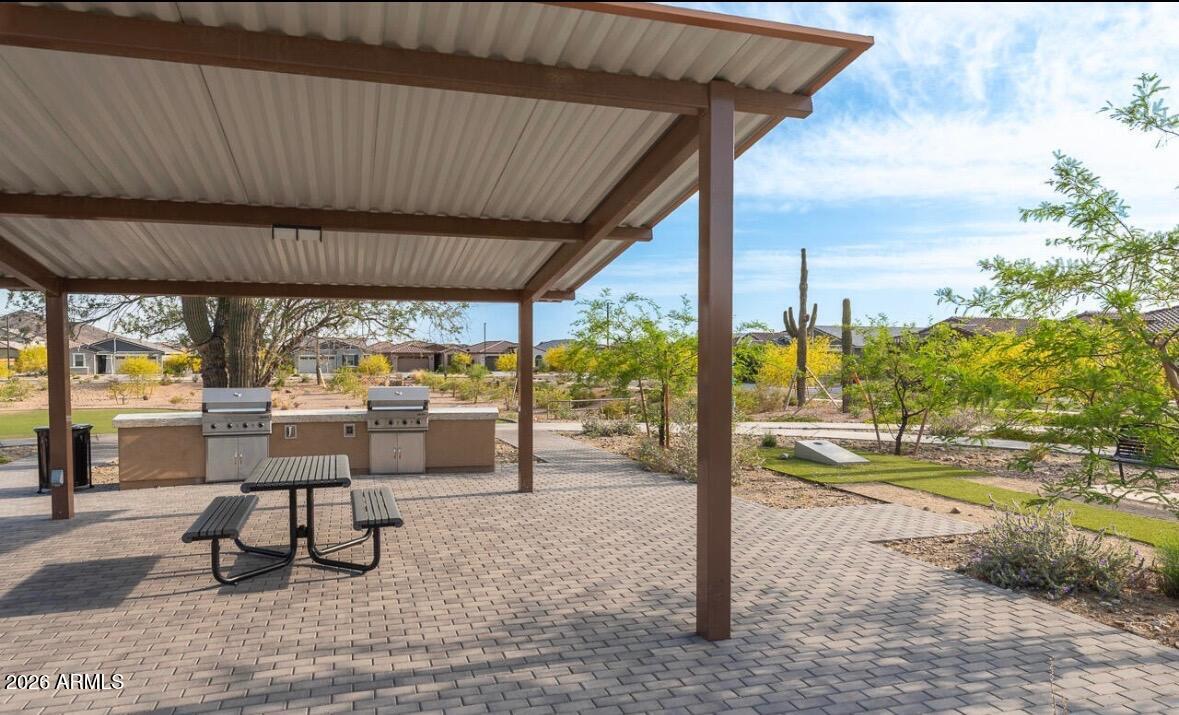 2034 West Sleepy Ranch Road Phoenix, AZ 85085 - Photo 29 of 35 a view of a patio with a table chairs and a patio