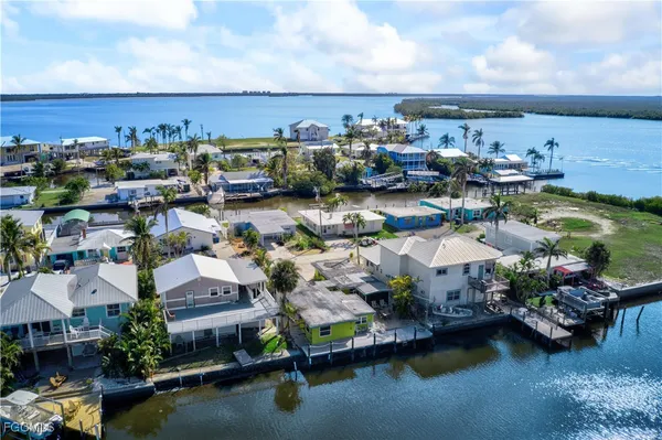 a front view of a house with a garden and sitting area